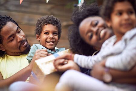 Afro-American young boy enjoying  outdoor at birthday party.の写真素材