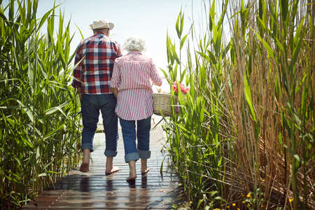 Old couple in love enjoys romantic moments on a sunny dayの写真素材