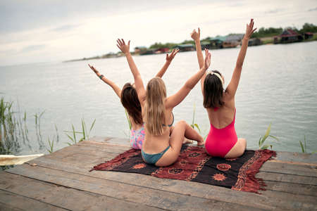 Young tourist happy women have fun on the dock on lake.の写真素材