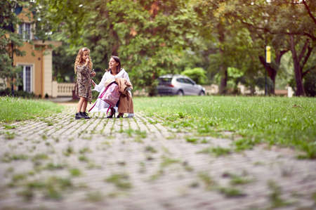 Mom and daughter getting ready for the schoolの写真素材