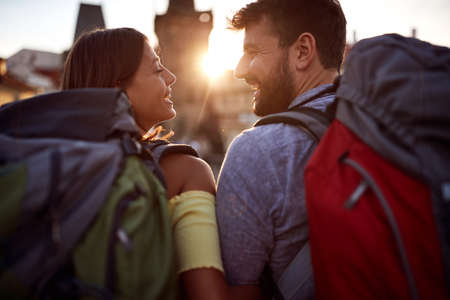 Happy man and woman in love traveling,having fun at europe vacation at sunset.の写真素材