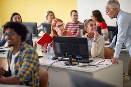Female pupils in classroom with teacher