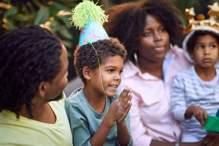afro-american family gathered on birthday partyの写真素材