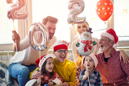 Family party at New Year eve in home festive atmosphere. New Year, holiday, family time togetherの写真素材