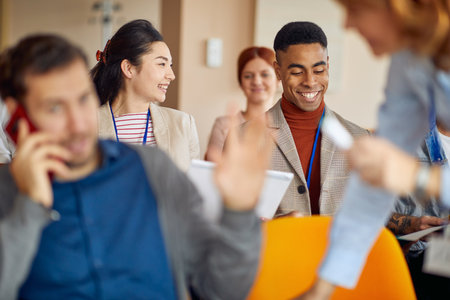 Business people enjoying meeting in a pleasant atmosphere in a conference hall. People, job,...