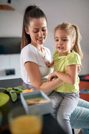 Mother and daughter spending time together at homeの写真素材