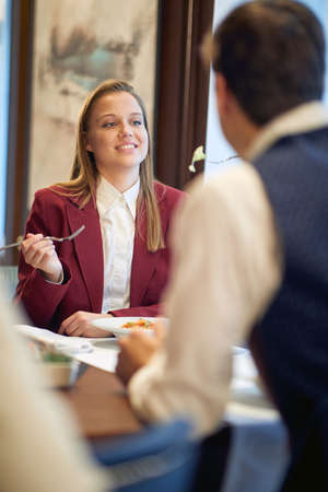 Young couple in love enjoying the food at a lunch in a relaxed atmosphere at the restaurant. Couple, love, restaurant, togetherの写真素材