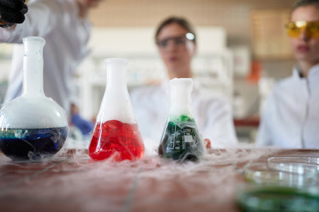 Laborant technicians conducting chemical reactions experiment in the lab
