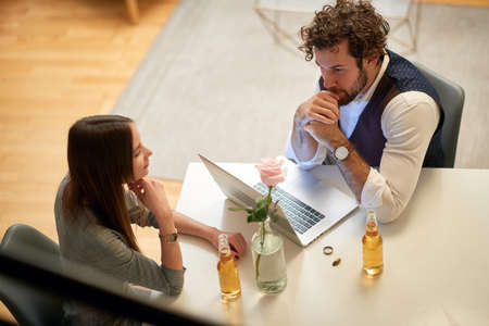 A young businessman at home office at thinking if young sexy female candidate is suitable for a job....