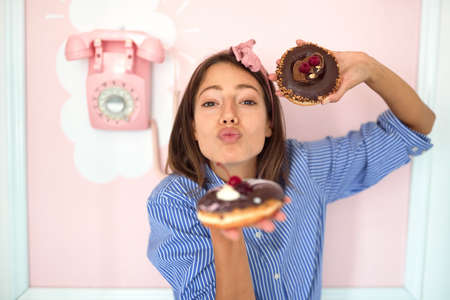 Small business owner is passionate about her tasty product/ donutsの写真素材