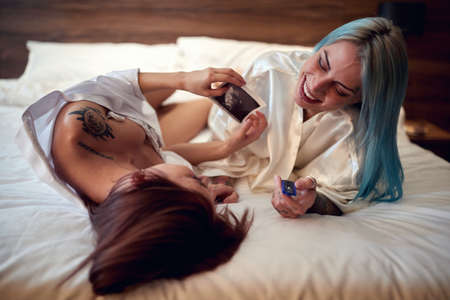 Joyful lesbian couple sharing a pregnancy test results together
