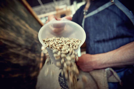 close up mans  hands drip coffee.Freshly  coffee beansの写真素材