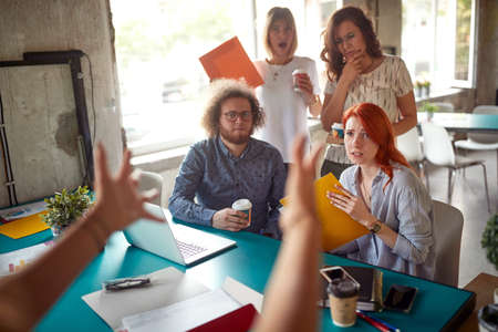 Mad boss yelling at the employess at the officeの写真素材