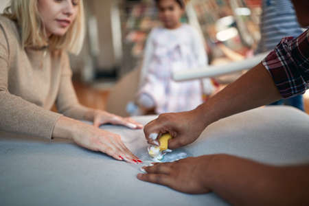 family cleaning dirt with sponge  together indoorの写真素材