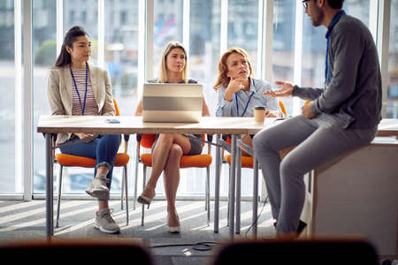 business women discussion with young man  colleague in the office