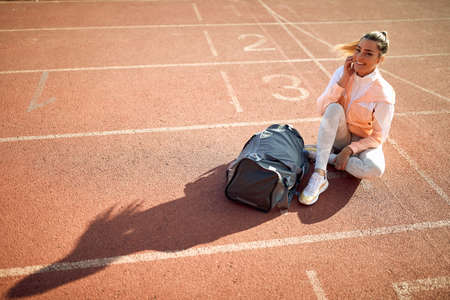 Fit caucasian female runner training for the race at the stadium