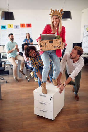 A group of joyful employees are having a good time in a cheerful atmosphere at the office. Employees, job, officeの写真素材