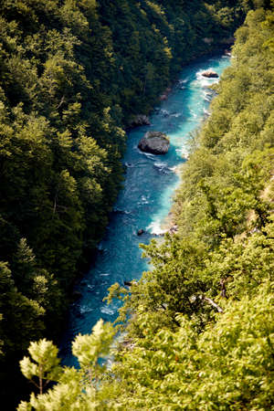 Turquoise mountain river flows in a beautiful  mountain canyon.Aerial  view.