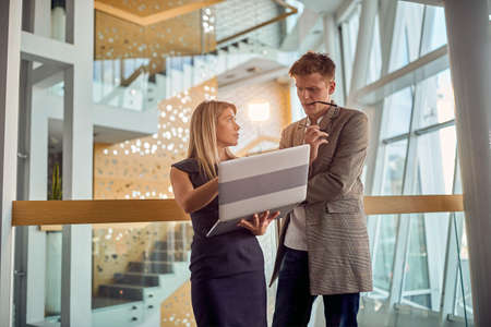 Two motivated work colleagues consulting on a project