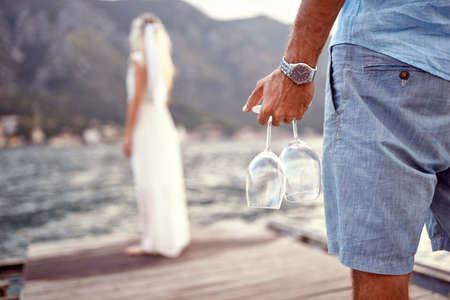 Young man holding glasses  wine.Romantic surprise concept