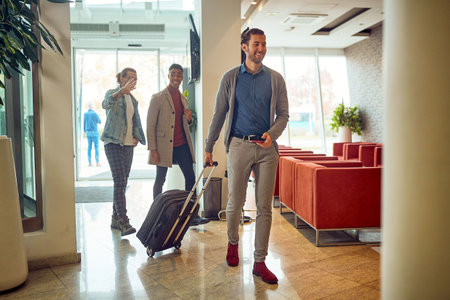 Group of business colleagues arriving to a hotel on a business tripの写真素材