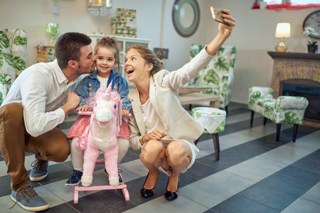 Family captures fun moments amongst beautiful lightingの写真素材