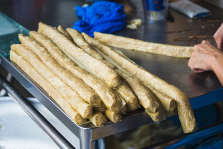 Making crab meat roll with hands