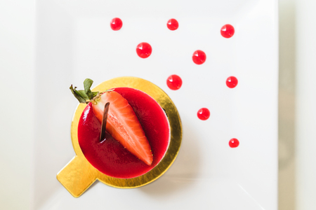 top view strawberry shortcake on white dishの写真素材