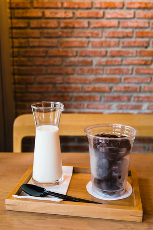 Frozen chocolate with fresh milk on wooden tableの写真素材