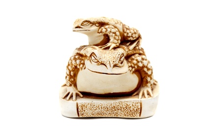 Netsuke Money Toad  on white background.の写真素材