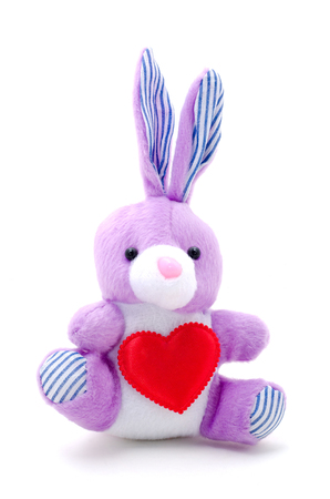 light purple toy bunny rabbit sitting with heart.の写真素材