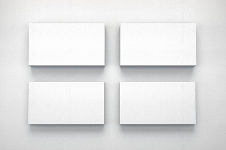 Mockup of four business cards on white textured paper studio. High resolution 3d render.の写真素材