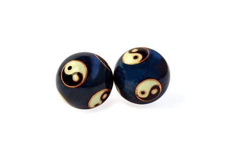 Stress balls with Yin Yang symbols on white. path included.