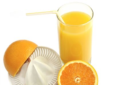 Juicer with slices of orange and glass of fresh juice isolated over white.の写真素材