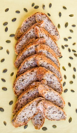 Slices of Alpine Baguette in the shape of Christmas tree whith pumpkin seeds. Christmas theme.