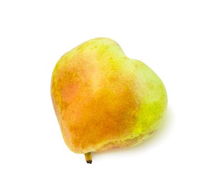 Ripe blushful heart shaped pear isolated over white.の写真素材