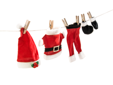 Santa Claus suit hanging on clothesline. Christmas theme. Horizontal.の写真素材