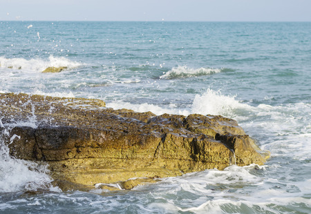 Waves and stoneの写真素材