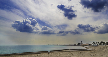 Manfredonia, Gargano, Apulia, wide view with clouds and lighthouse on background.の写真素材