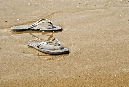 Summer shoes on the beachの写真素材