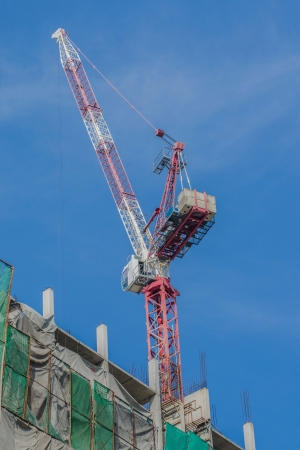 Large cranes are working on the building site の写真素材