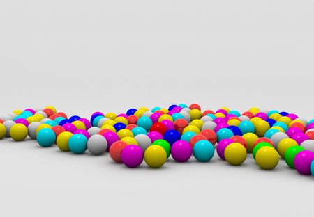 Yellow red blue pink color shaded ballsの写真素材