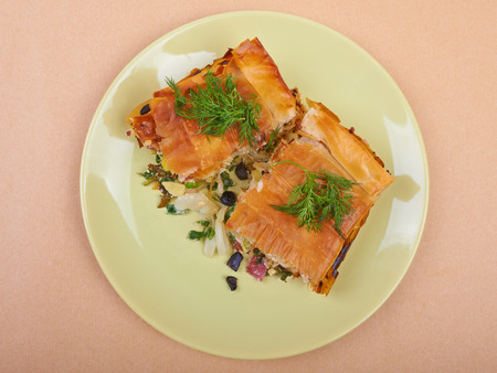 Pie with vegetables and salami