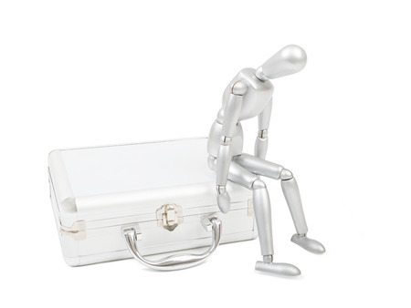 Model man sitting on a suitcase isolated on a white backgroundの写真素材