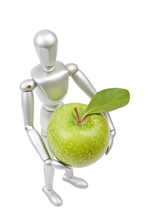 Silver mannequin human model with apple isolated on white backgroundの写真素材