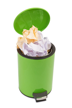 Waste can full up with crumpled paper. Isolated on white backgroundの写真素材