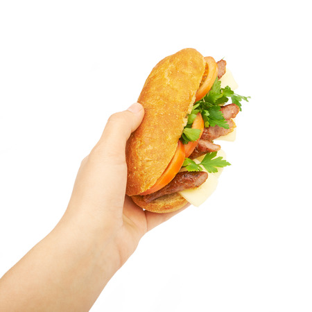 Sandwich in hand isolated on white backgroundの写真素材