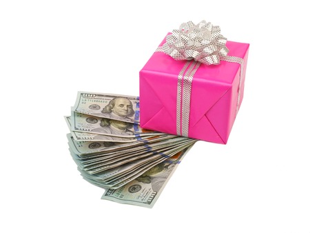 Hundred dollar bills and gift box isolated on white background