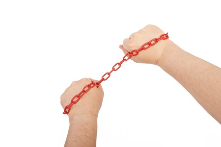 Hands in chain isolated on a white backgroundの写真素材