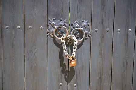 Door handle on wooden background